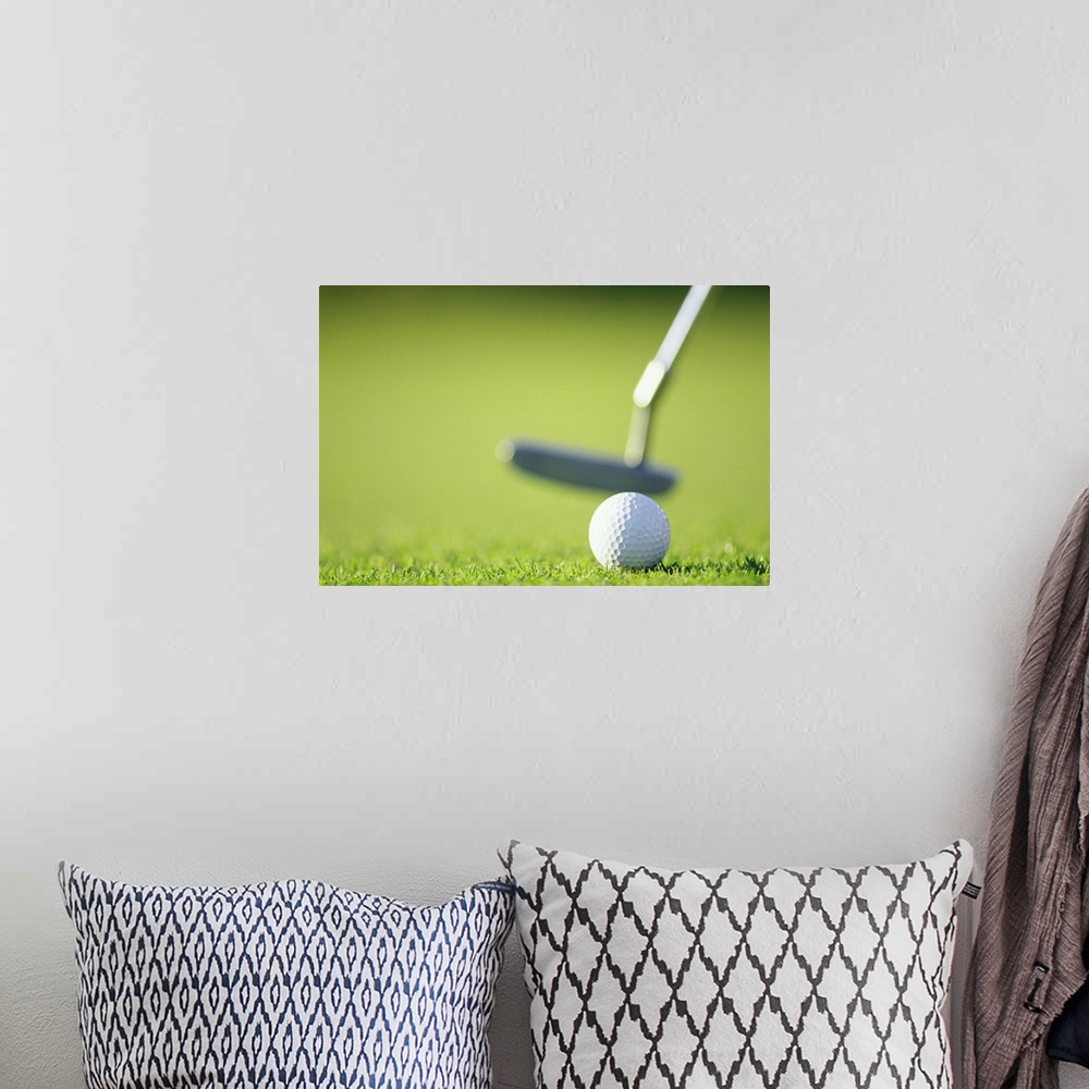 A bohemian room featuring Golf ball with putter