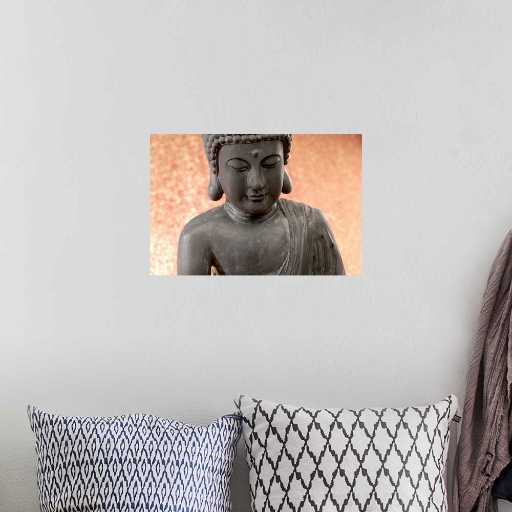 A bohemian room featuring Hindu Buddha statue