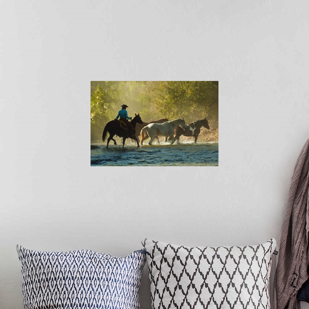 A bohemian room featuring Horseback Rider Herding horses