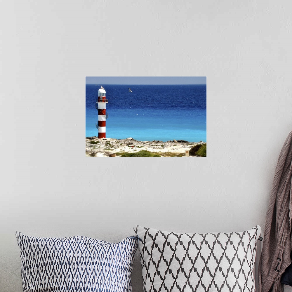 A bohemian room featuring Lighthouse against beach in Cancun, Mexico.