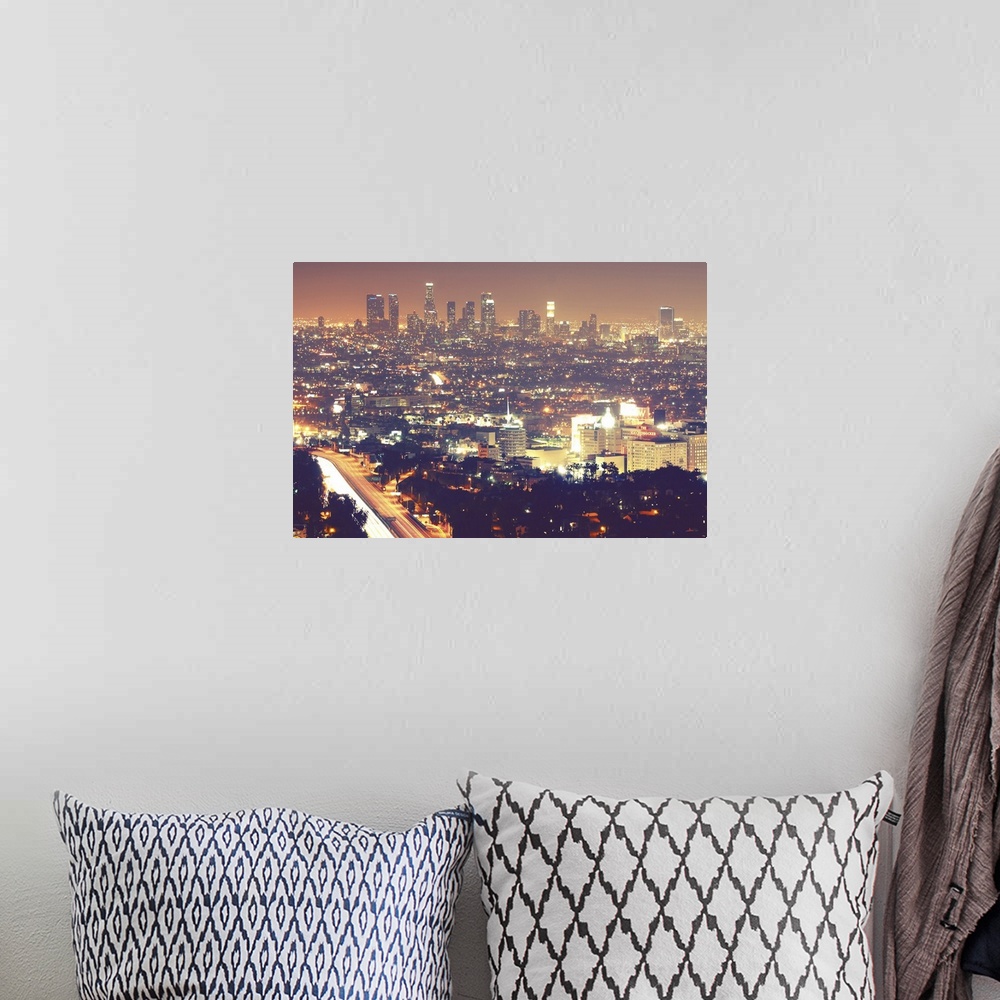 A bohemian room featuring Los Angeles skyline city at night.