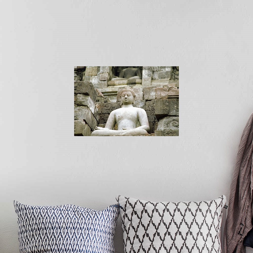 A bohemian room featuring Low angle view of the Statue of Buddha, Borobudur Temle, Java, Indonesia