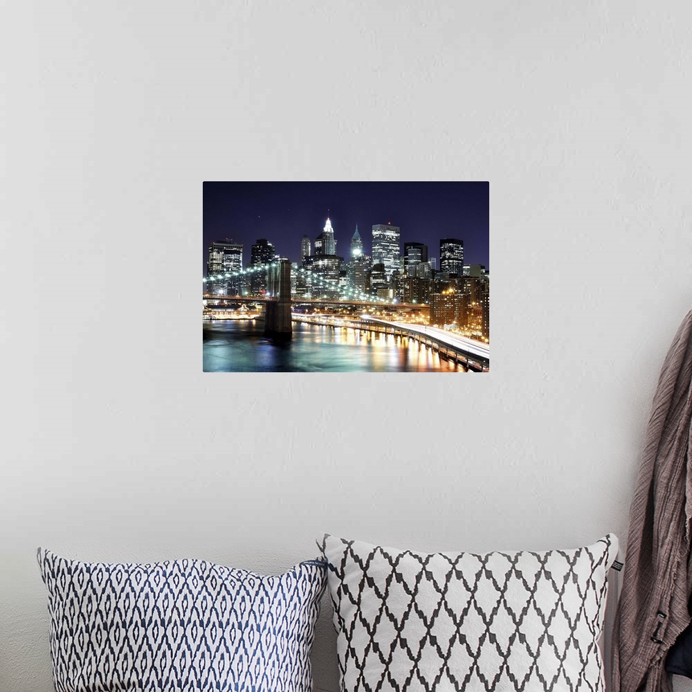 A bohemian room featuring Aerial view of lower Manhattan including the financial district and the Brooklyn Bridge at night.