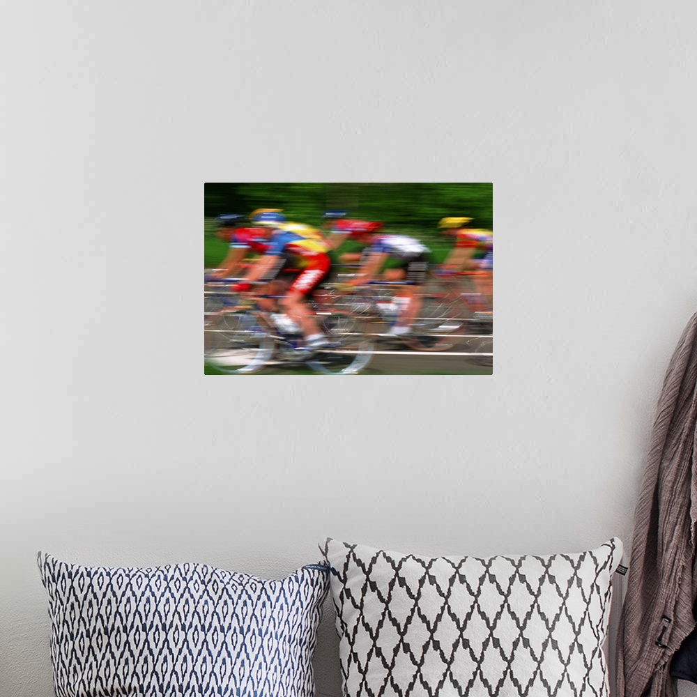 A bohemian room featuring Male cyclist riding bicycle (blurred motion)