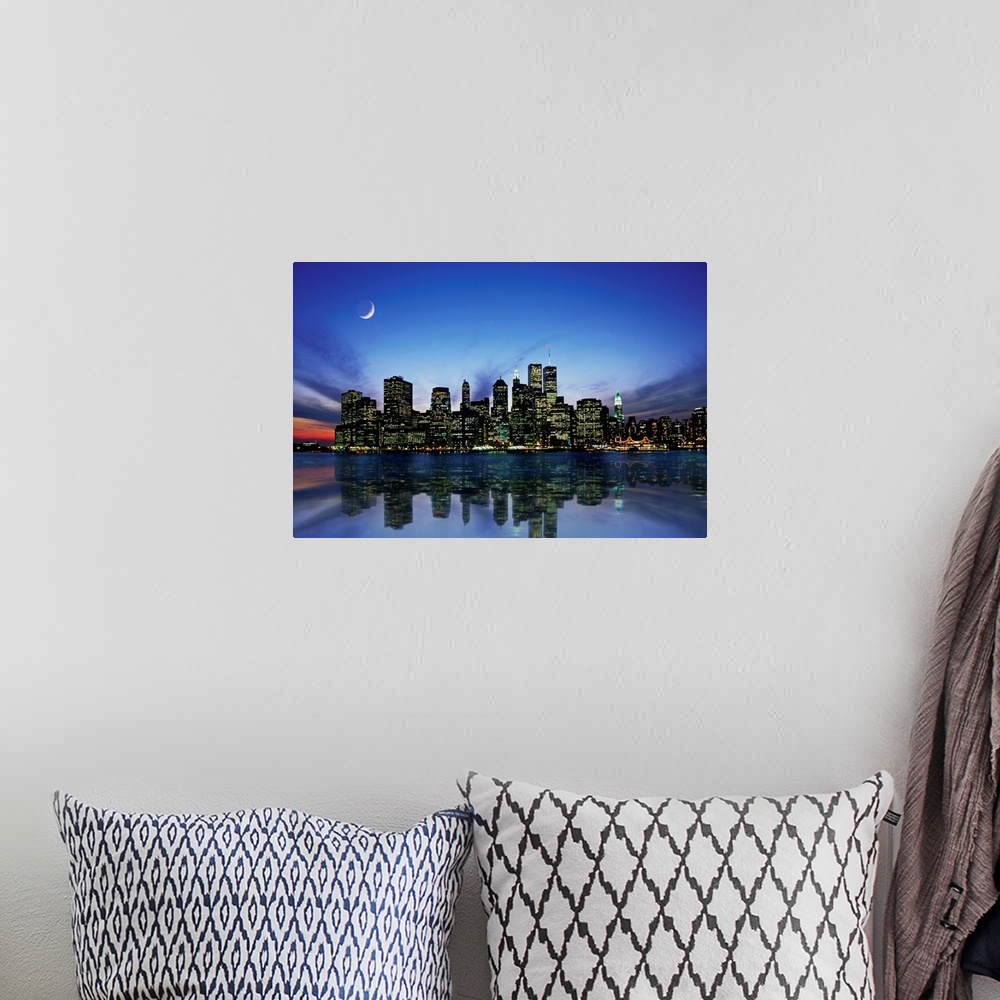 A bohemian room featuring Manhattan skyline at night, reflecting in river