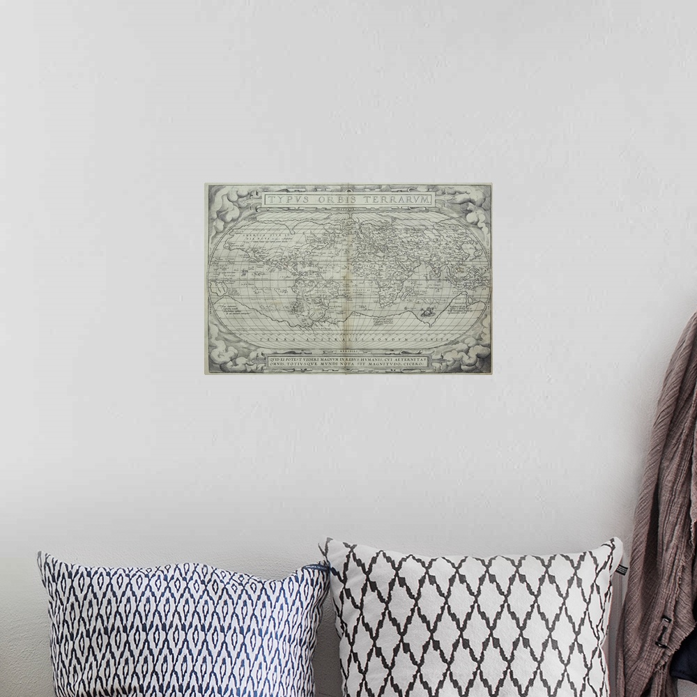 A bohemian room featuring This large piece is an antique black and white map of earth.