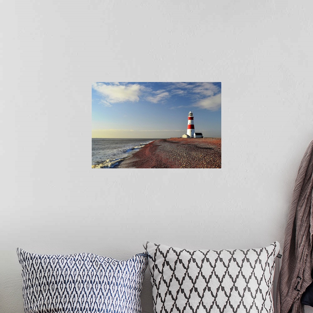 A bohemian room featuring Morning light at Orford Ness Lighthouse with sea and sea in background.