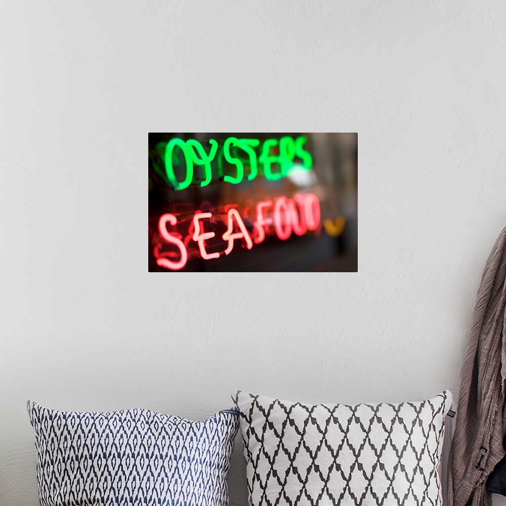 A bohemian room featuring Neon oysters and seafood sign