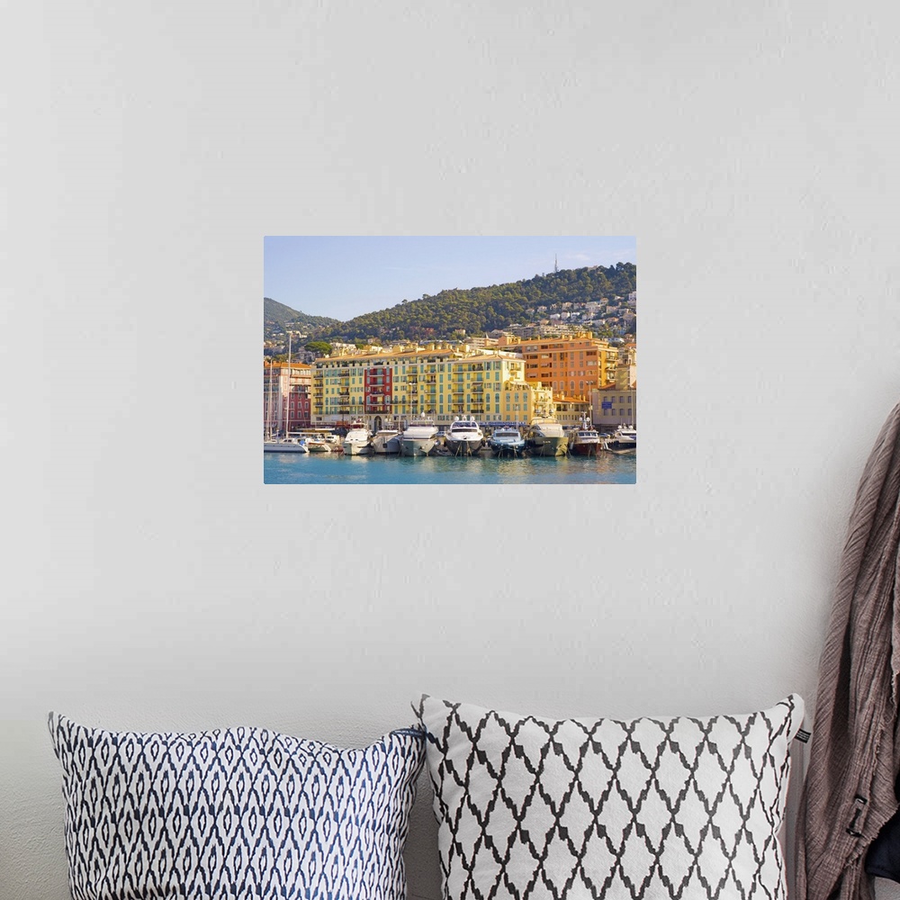 A bohemian room featuring Nice Harbour, Cote d'Azur with ship and building in France.