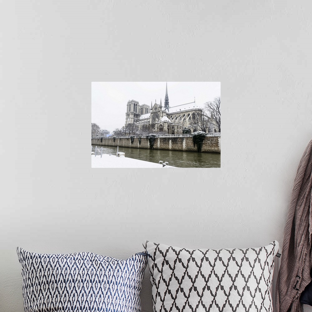 A bohemian room featuring Notre Dame, the great cathedral in the center of Paris. As seen from Quai de Montebello