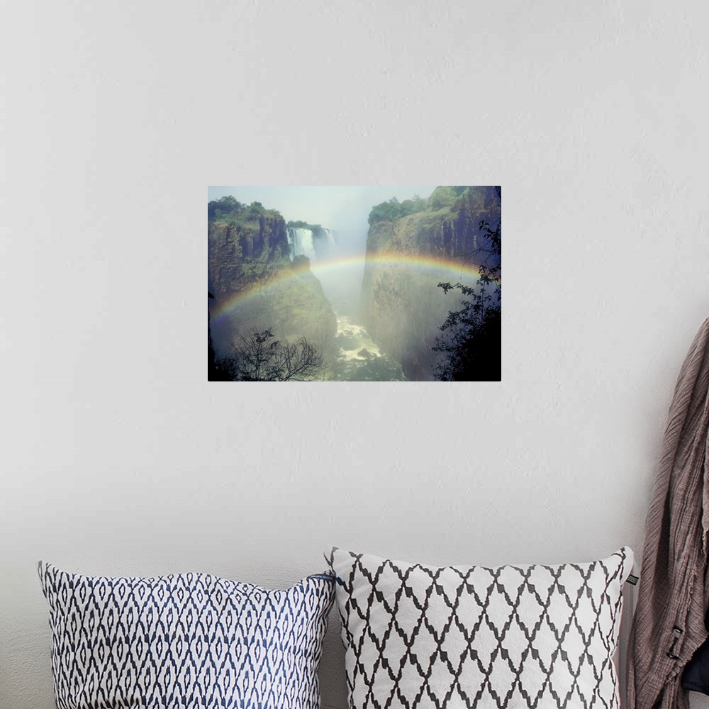 A bohemian room featuring Rainbow over misty river canyon