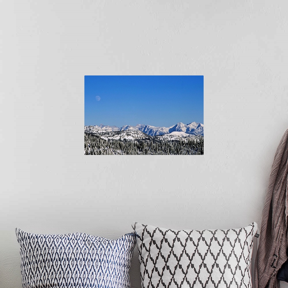 A bohemian room featuring Rocky Mountains & spine of Continental Divide in Glacier National Park, MT during winter seen fro...