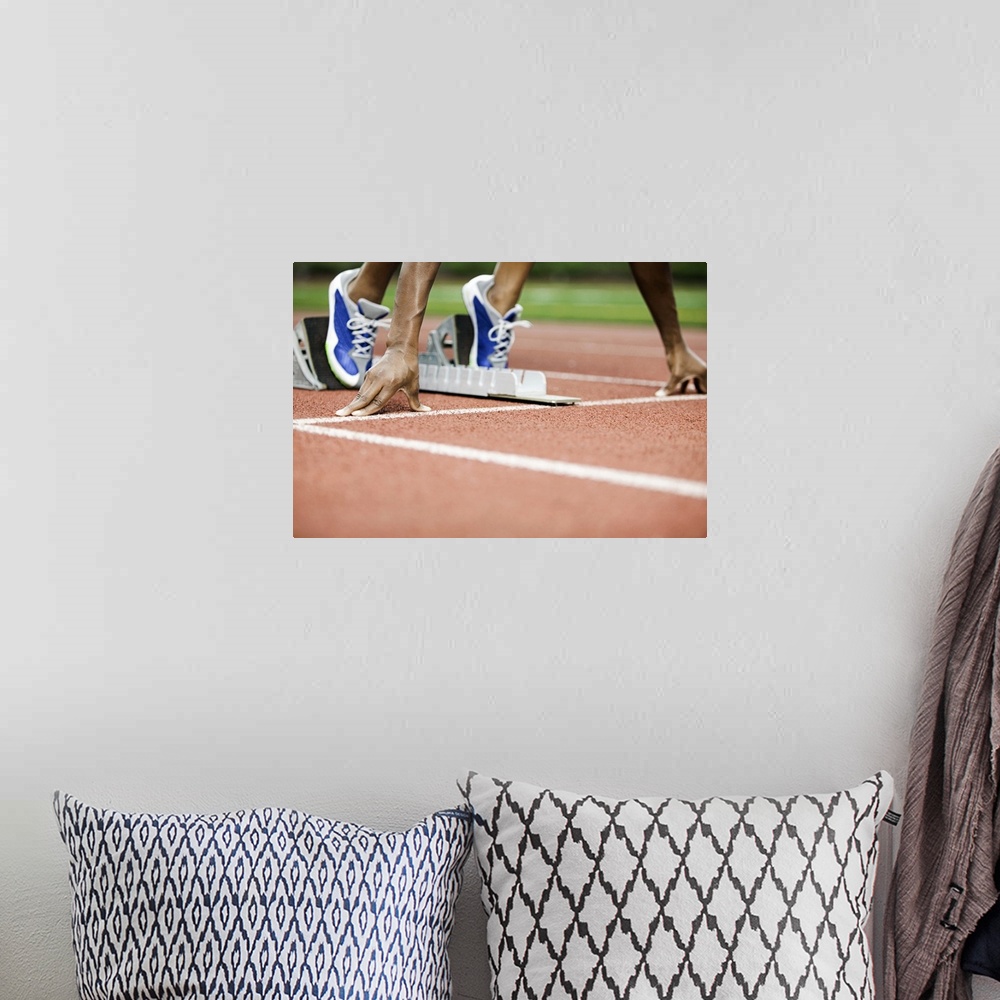 A bohemian room featuring Large photo on canvas of a track athlete at the starting line about to take off sprinting.