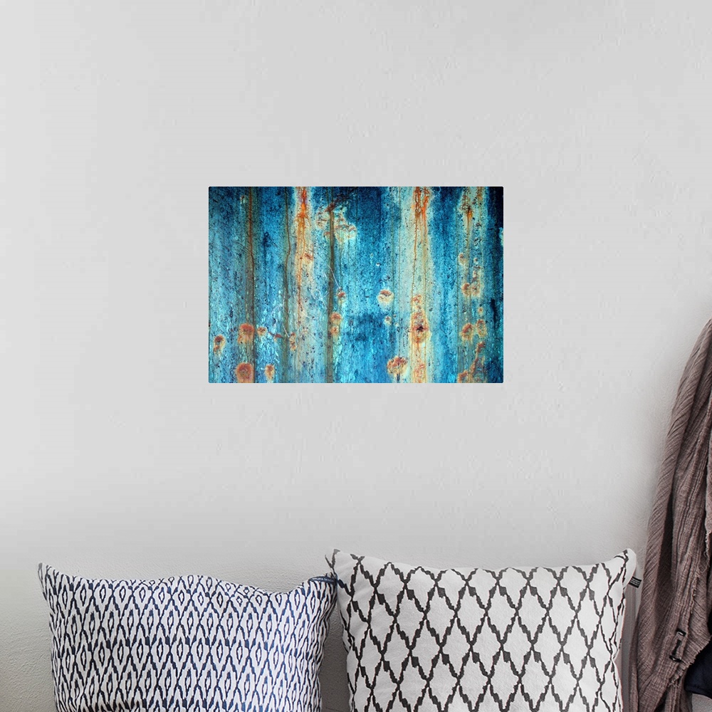 A bohemian room featuring Large photograph shows a rough textured surface that has been heavily affected by oxidation and c...