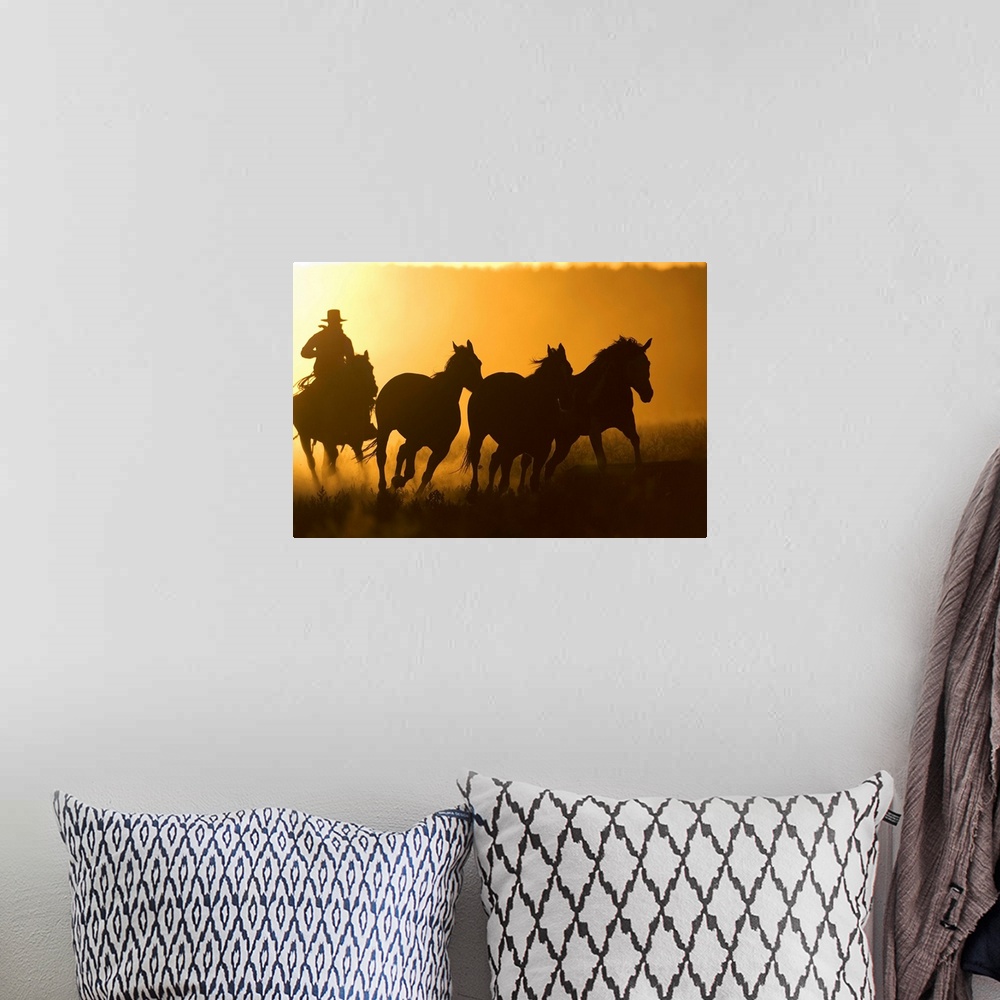 A bohemian room featuring Silhouette Of Cowboy Herding Horses