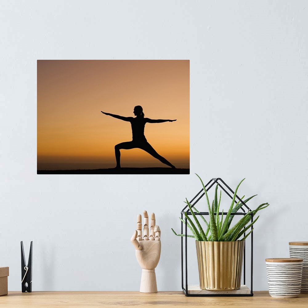 A bohemian room featuring Silhouette of woman doing yoga