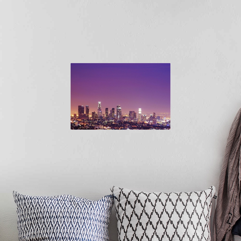 A bohemian room featuring Skyscrapers at dusk.