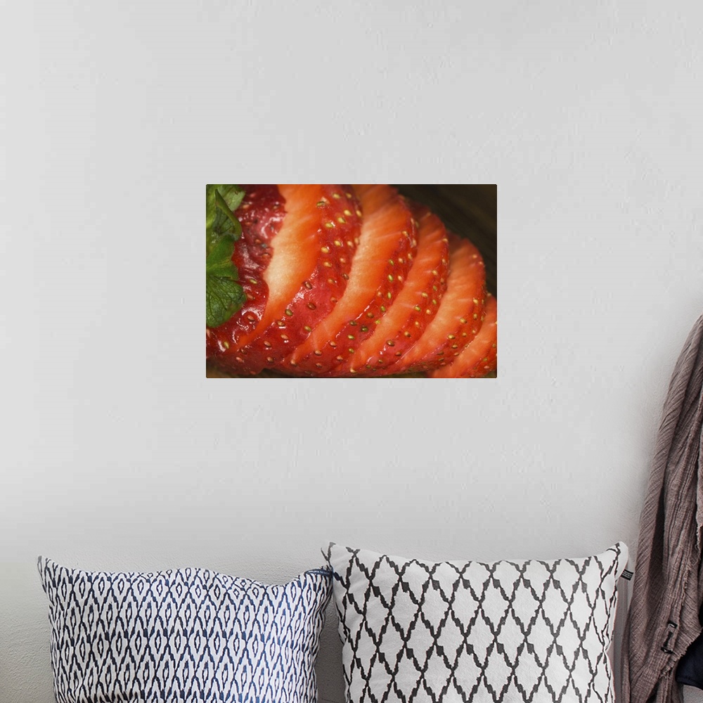 A bohemian room featuring Sliced strawberry on wood cutting-board