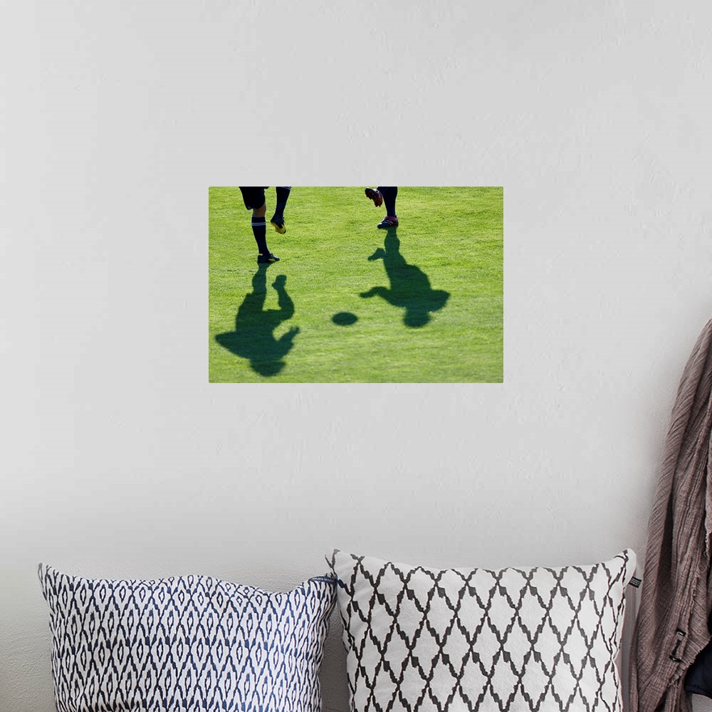 A bohemian room featuring Soccer players doing drills.