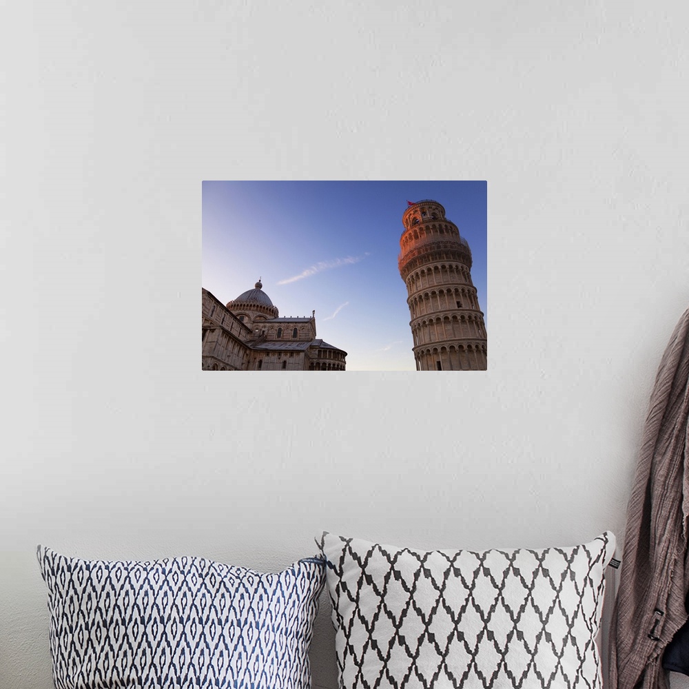 A bohemian room featuring Sunlight on the top of the Leaning tower of Pisa at dusk, with the Duomo
