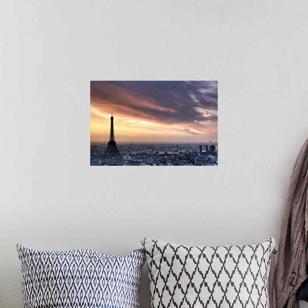 A bohemian room featuring Big, horizontal photograph of the sun rising through wispy clouds as the Eiffel Tower looms over ...