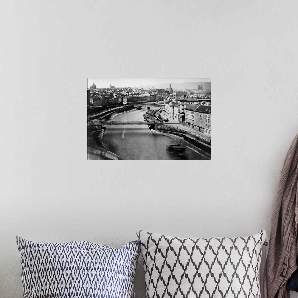 A bohemian room featuring A view of the Danube Canal as it passes through the city of Vienna.