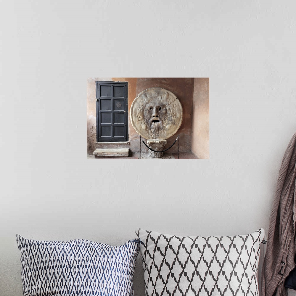 A bohemian room featuring Horizontal photograph on a large canvas of the a metal door next to the roped off sculpture "The ...