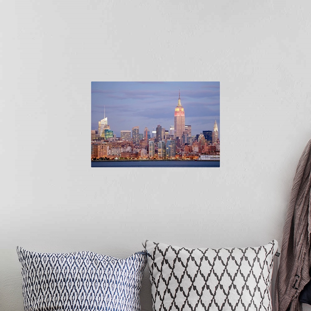 A bohemian room featuring USA, New York State, New York City, Skyline at dusk