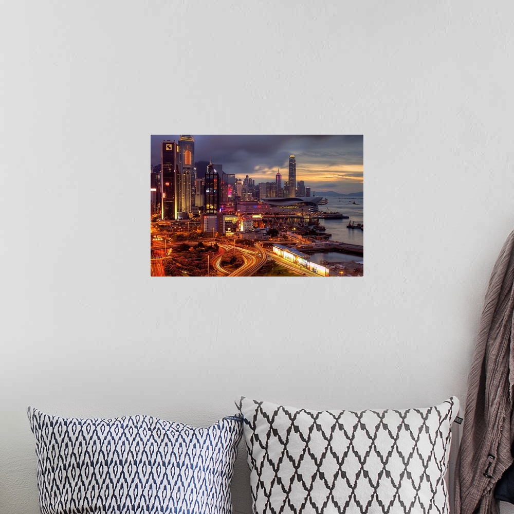 A bohemian room featuring Big landscape photograph of winding roads lading around and through the city of Hong Kong.  Skysc...