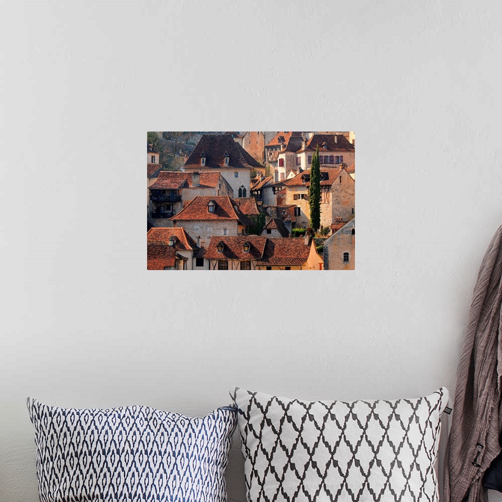 A bohemian room featuring Landscape photograph of the village of Saint Cirq Lapopie, at heart of historical Quercy region, ...