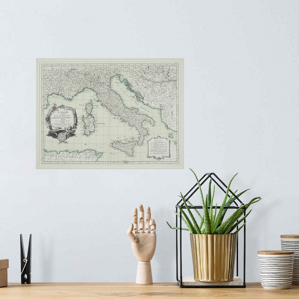 A bohemian room featuring Old French map of the Italian peninsula, including the islands of Corsica, Sardinia, and Sicily.