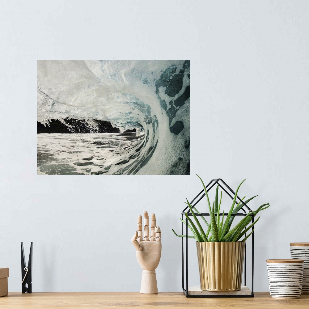 A bohemian room featuring Wave breaking over shallow reef.