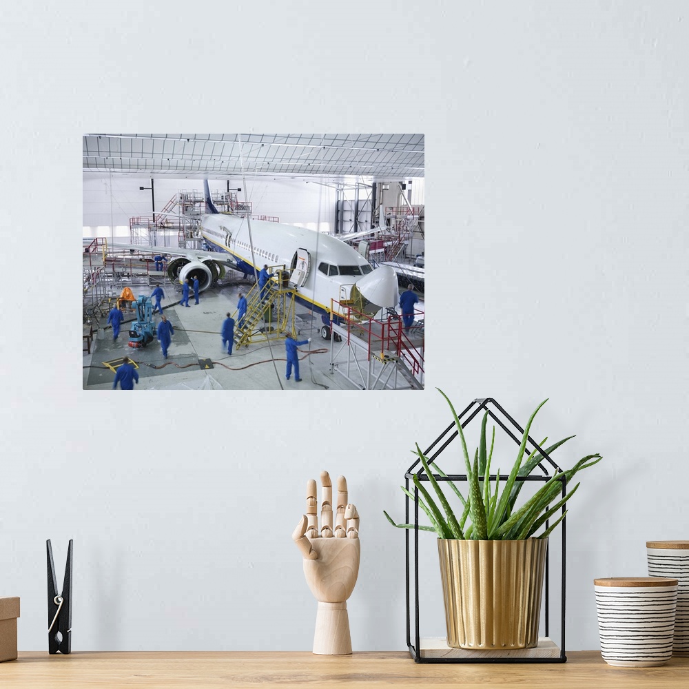 A bohemian room featuring Workers in airplane hangar