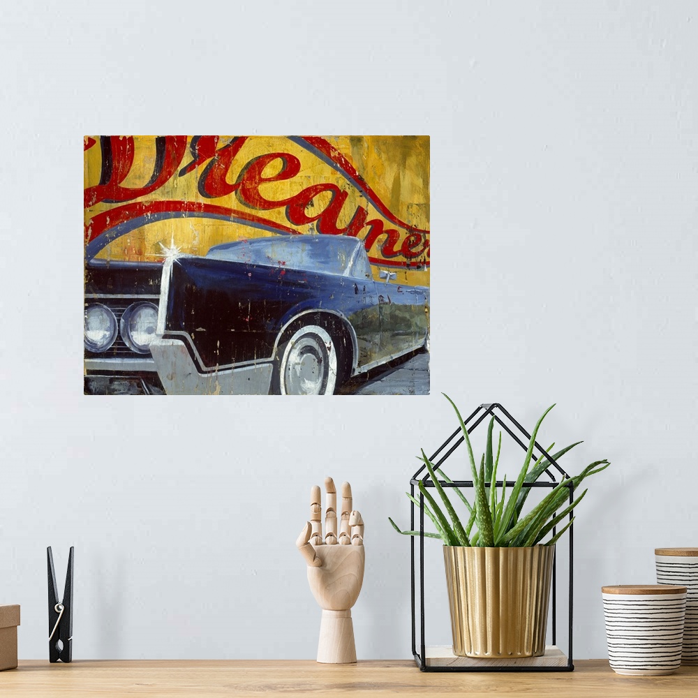 A bohemian room featuring Large landscape artwork of side angle view of a vintage convertible car, shining in the sunlight....