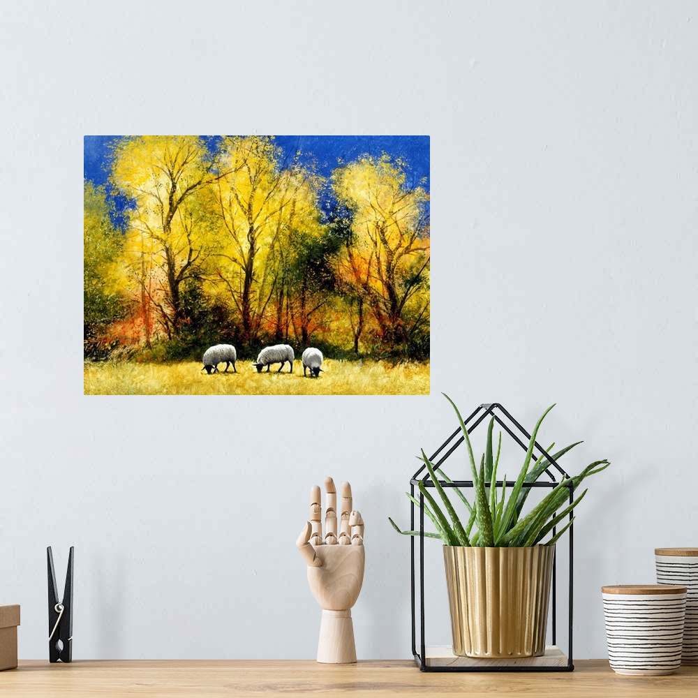 A bohemian room featuring Contemporary painting of three sheep grazing in an Autumn field.