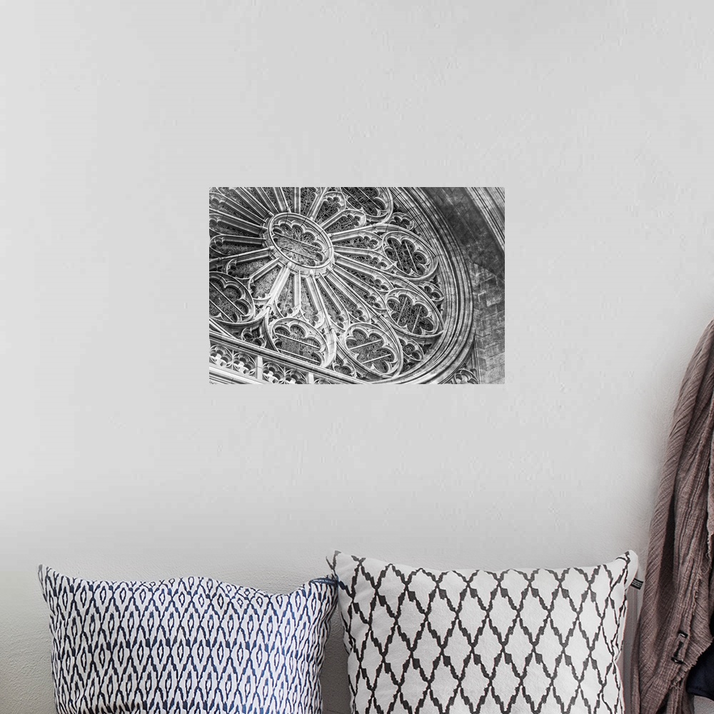 A bohemian room featuring A fine art photograph of the rose window of a cathedral.