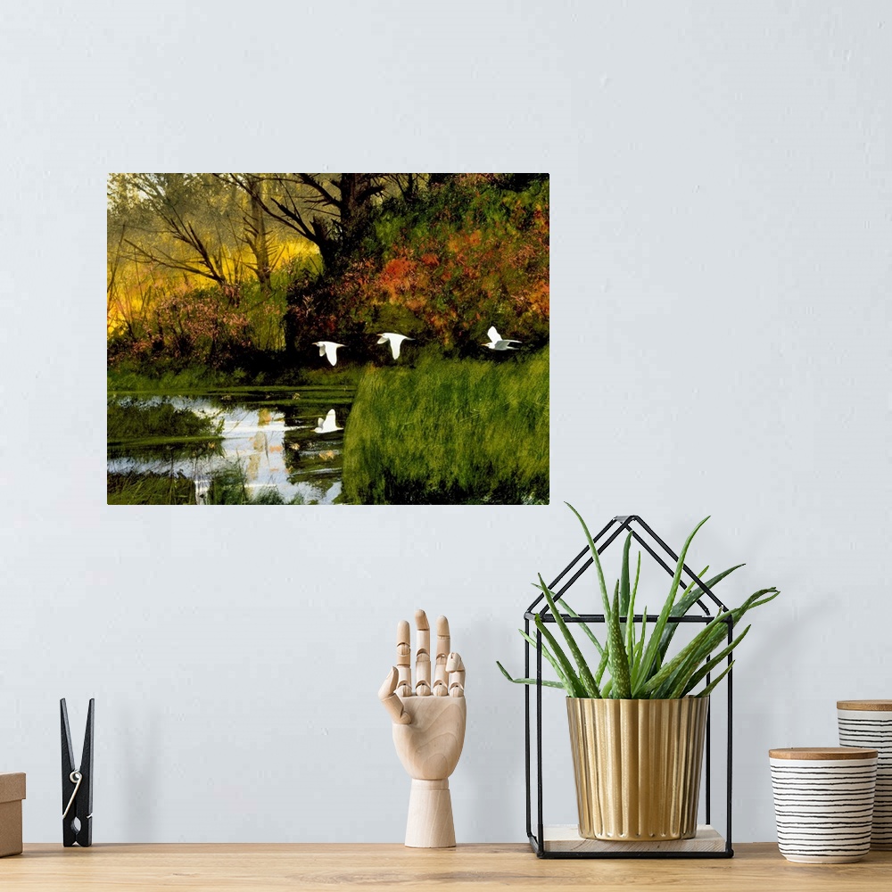 A bohemian room featuring Contemporary painting of three egrets flying over lush wetlands.