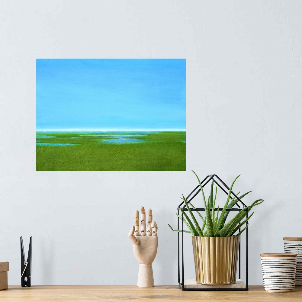 A bohemian room featuring Contemporary painting of a marsh landscape with clear blue skies above.