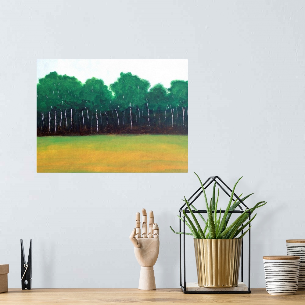 A bohemian room featuring Landscape painting of trees lining the edge of a forest next to an open field.