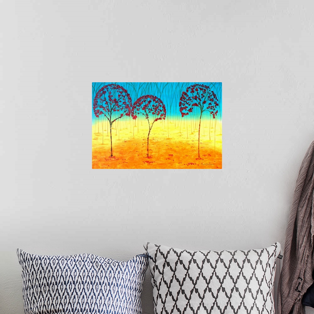 A bohemian room featuring Abstract landscape with red Autumn tree tops and an orange, yellow, and blue background.