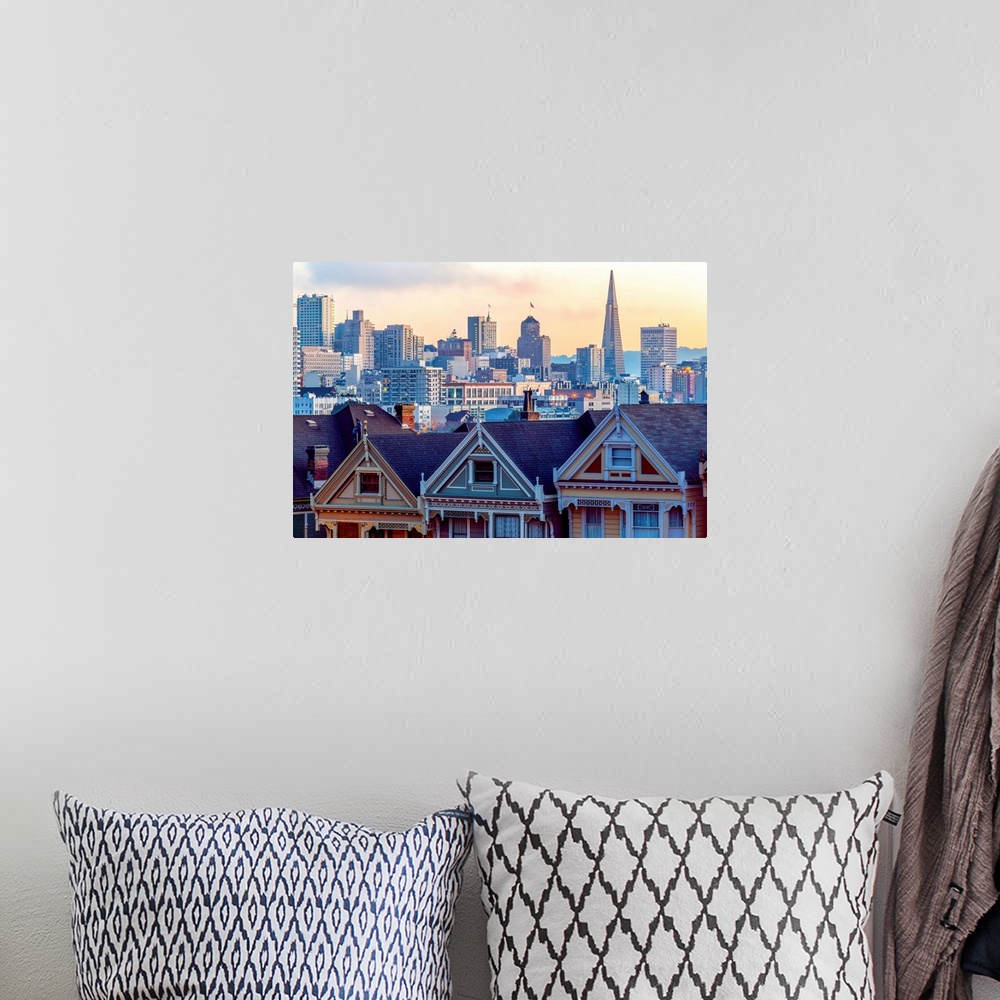 A bohemian room featuring Photography of a pastel-colored row of houses with the San Francisco skyline in the background.