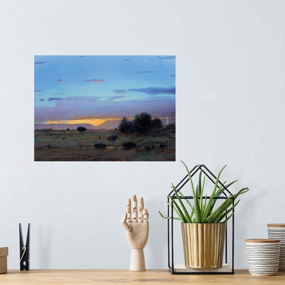 A bohemian room featuring A contemporary painting of a southwestern landscape under a blue stormy sky.