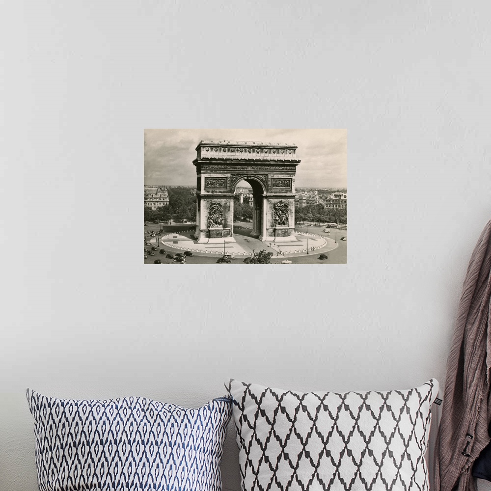 A bohemian room featuring Vintage postcard of the Arc de Triomphe in Paris, France.