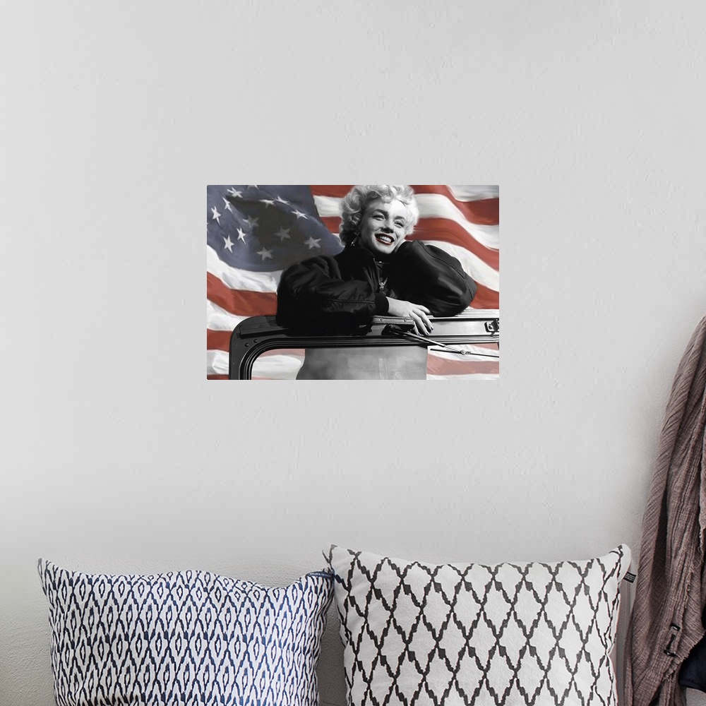A bohemian room featuring Painting of Marilyn Monroe standing in a Jeep with the American Flag waving behind her.