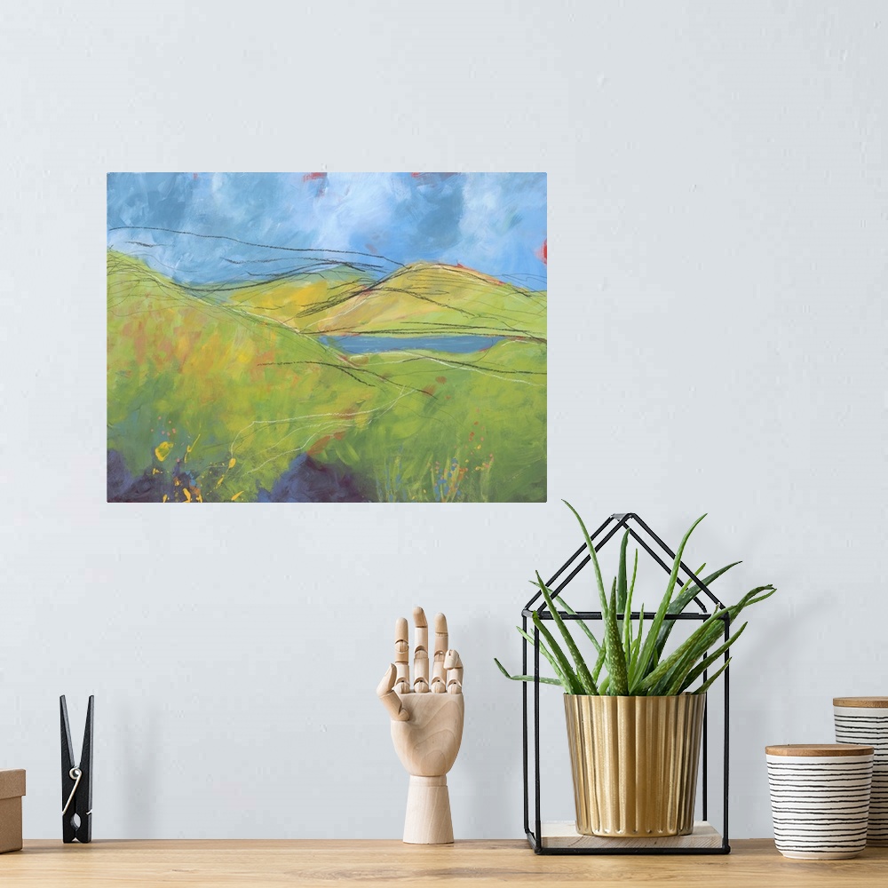 A bohemian room featuring Contemporary painting of a landscape with rolling green hills and pastel colored paint splatter r...