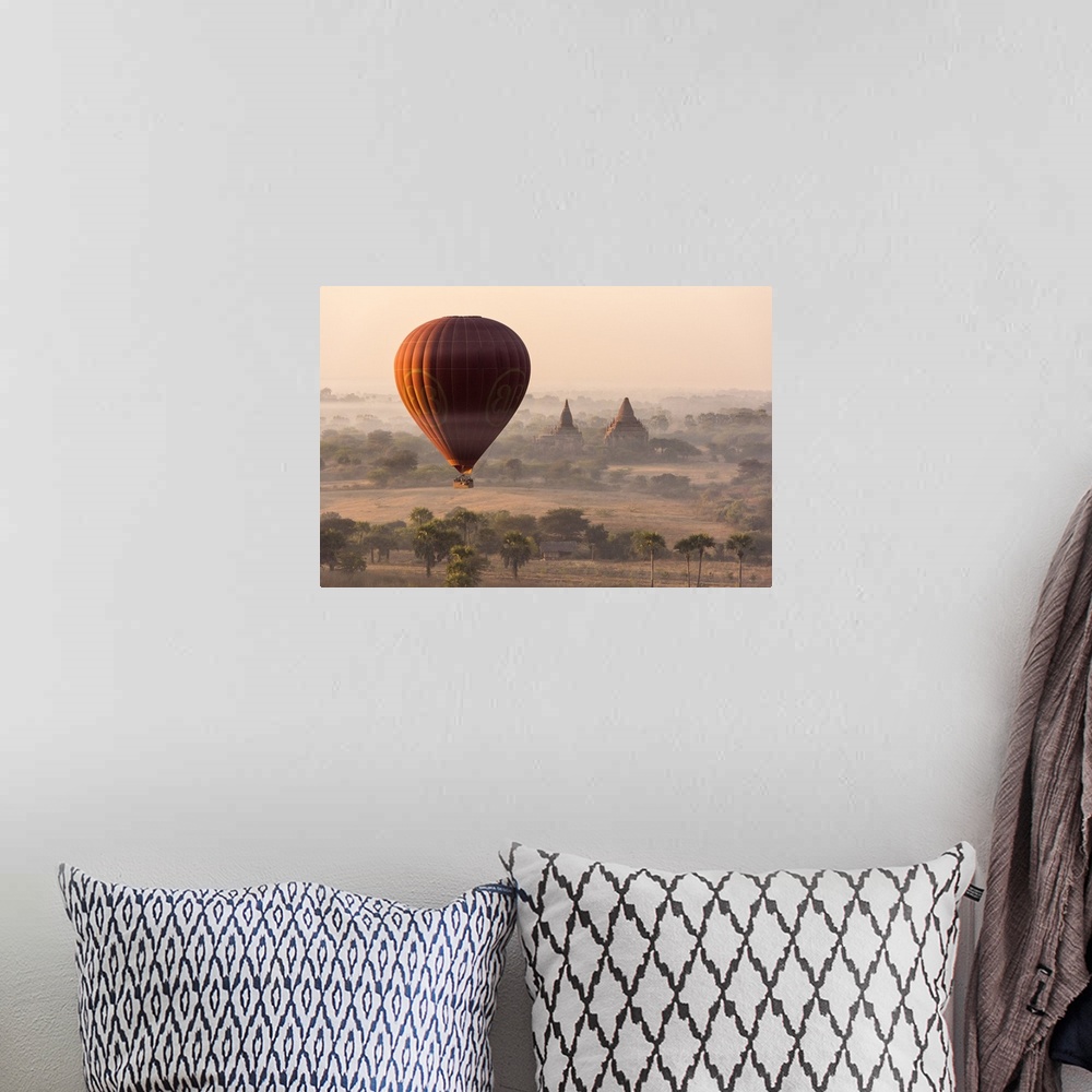 A bohemian room featuring A hot-air balloon flying over pagodas in Bagan, Myanmar