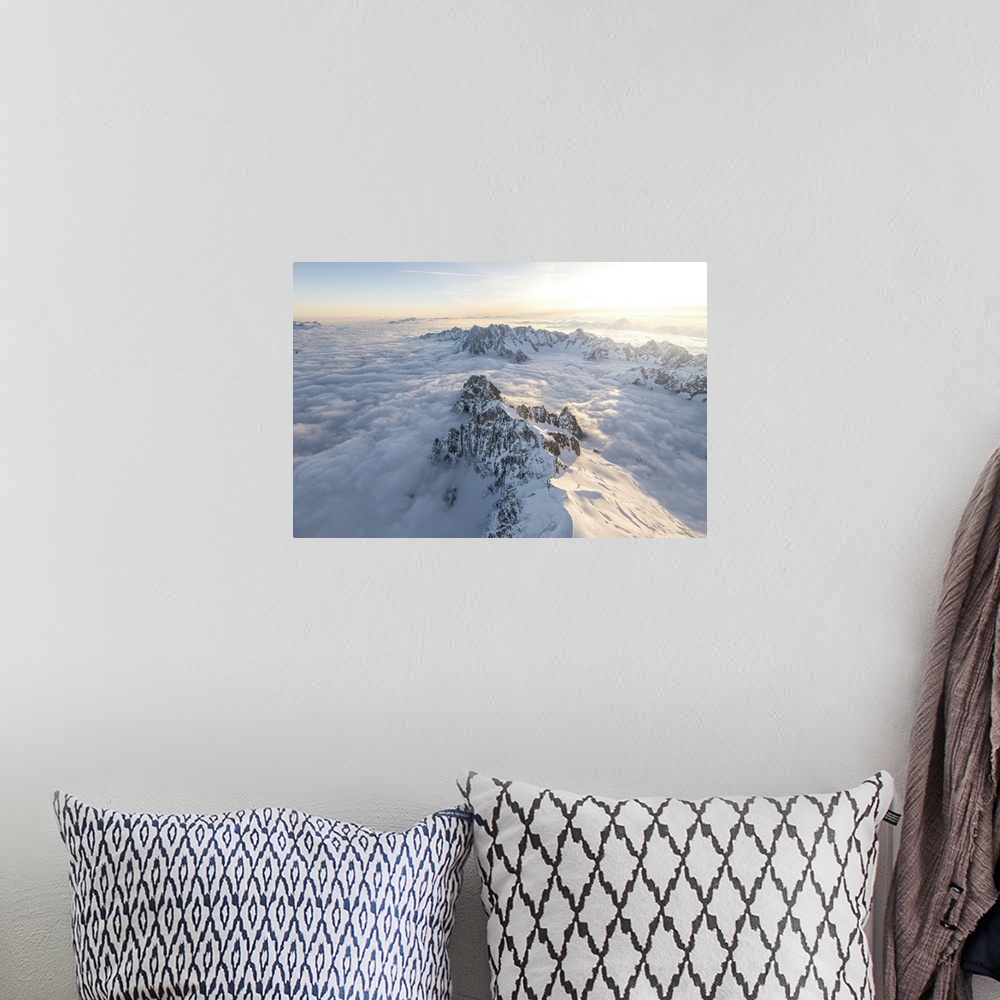 A bohemian room featuring Aerial view of snowy peaks of Mont Blanc during sunrise, Courmayeur, Aosta Valley, Italy, Europe....