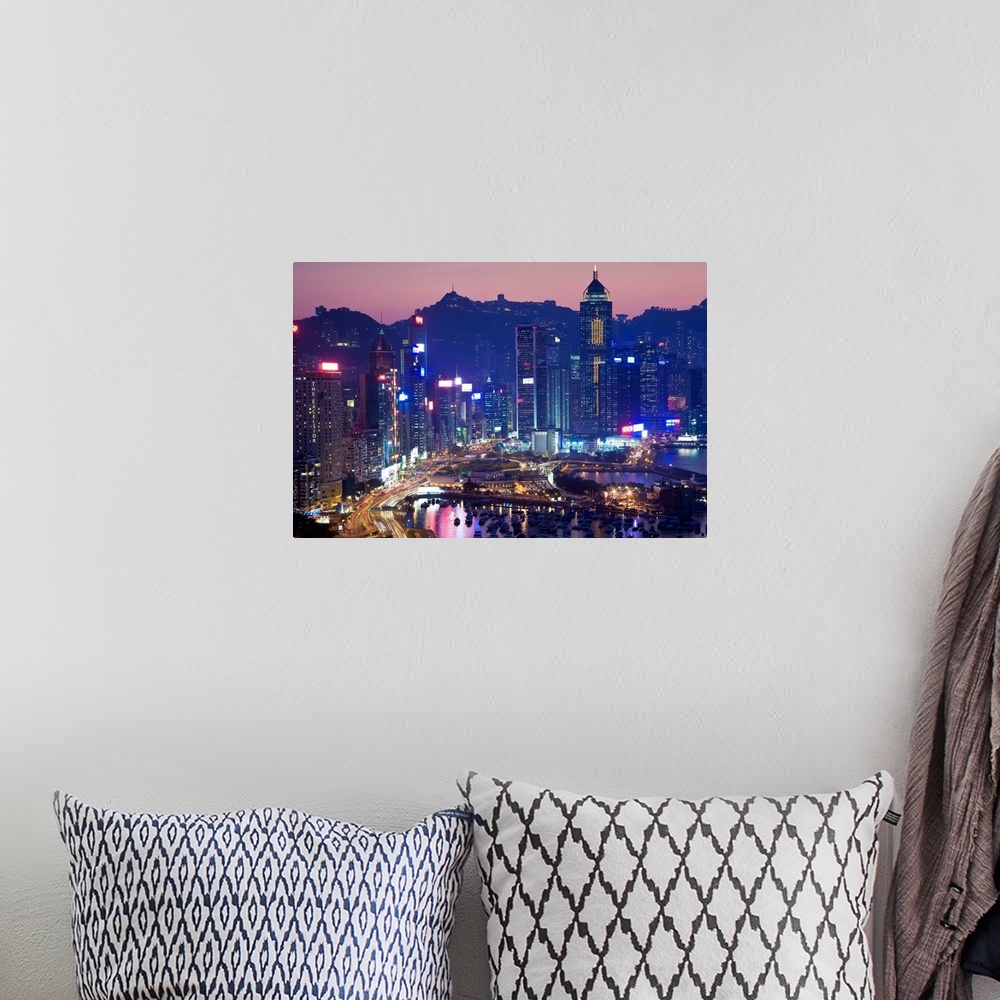 A bohemian room featuring China, Hong Kong, Hong Kong Island, view across harbour to Victoria Peak at sunset.