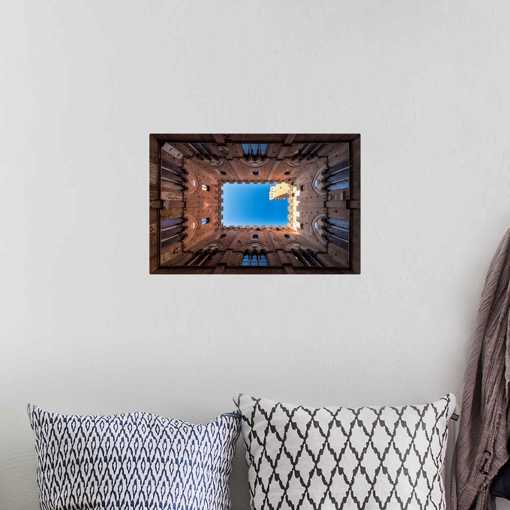 A bohemian room featuring Siena, Tuscany, Italy, Europe. Classic Bottom View Of Palazzo Pubblico With Del Mangia's Tower At...