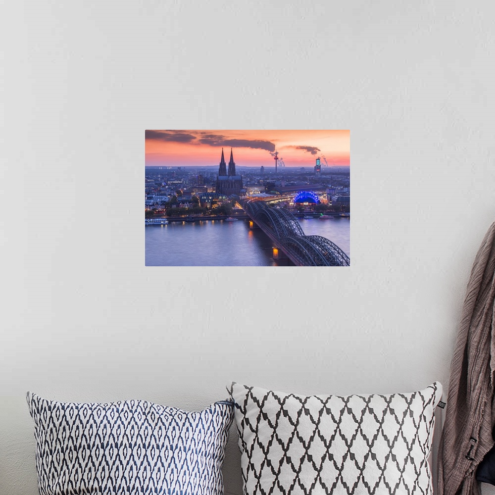 A bohemian room featuring Cologne Cathedral and Hohenzoller Bridge over River Rhine in Cologne city at dusk. Cologne city (...